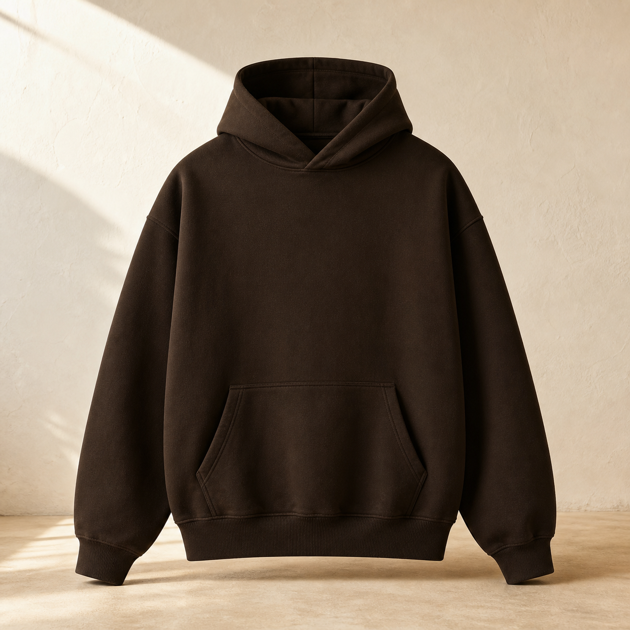 Dark umber heavyweight hoodie with a centered dawn-white Really Great wordmark