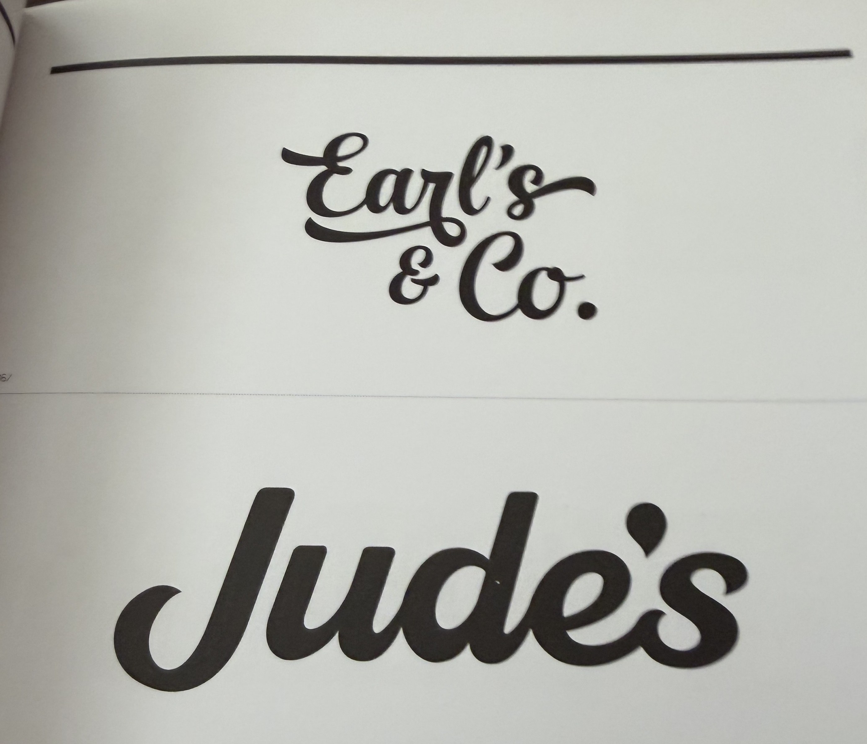 A photographed book page showing the Earl's and Co. and Jude's fat script wordmarks